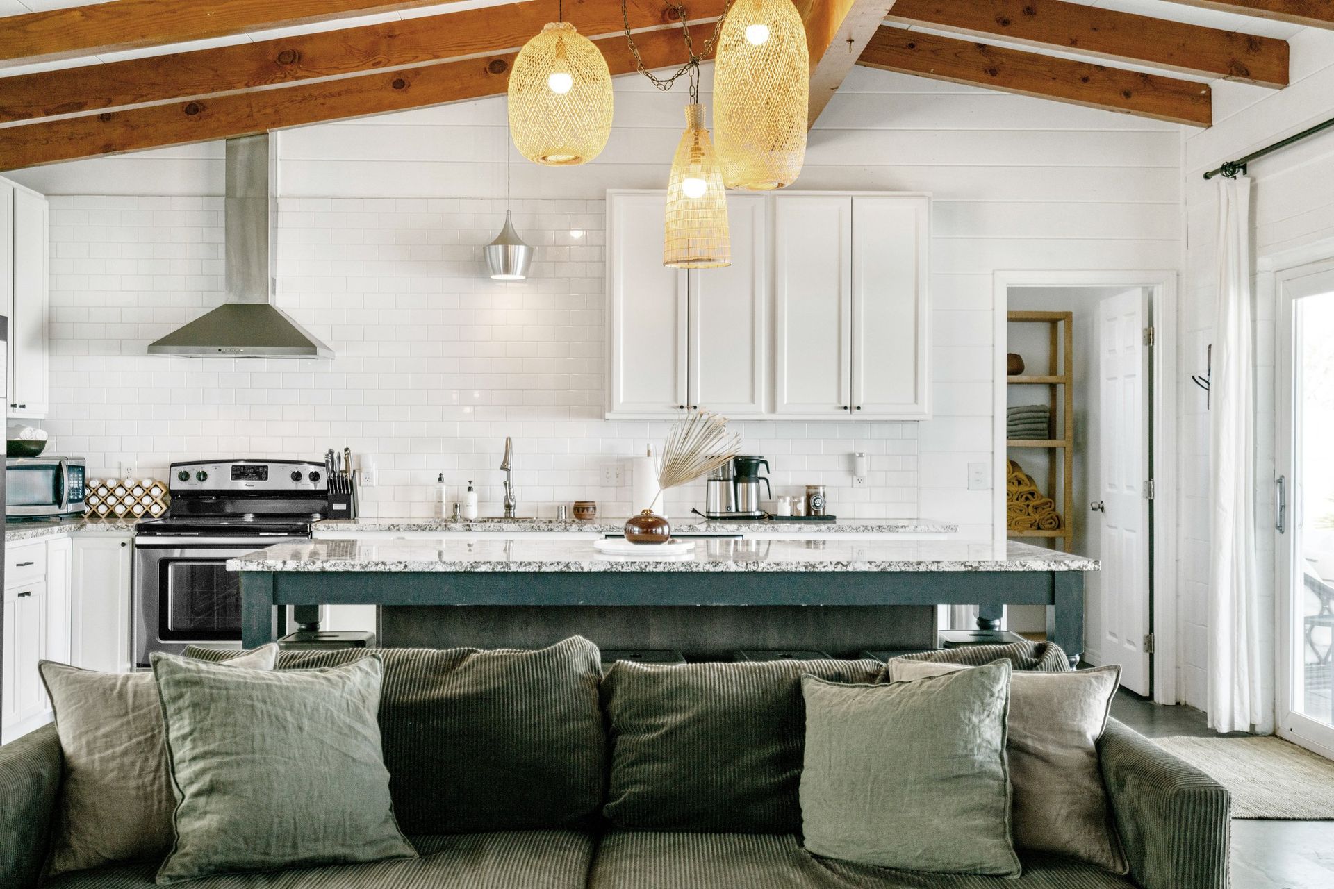 Wonder Valley Ranch open kitchen and living with vaulted ceiling and exposed beams