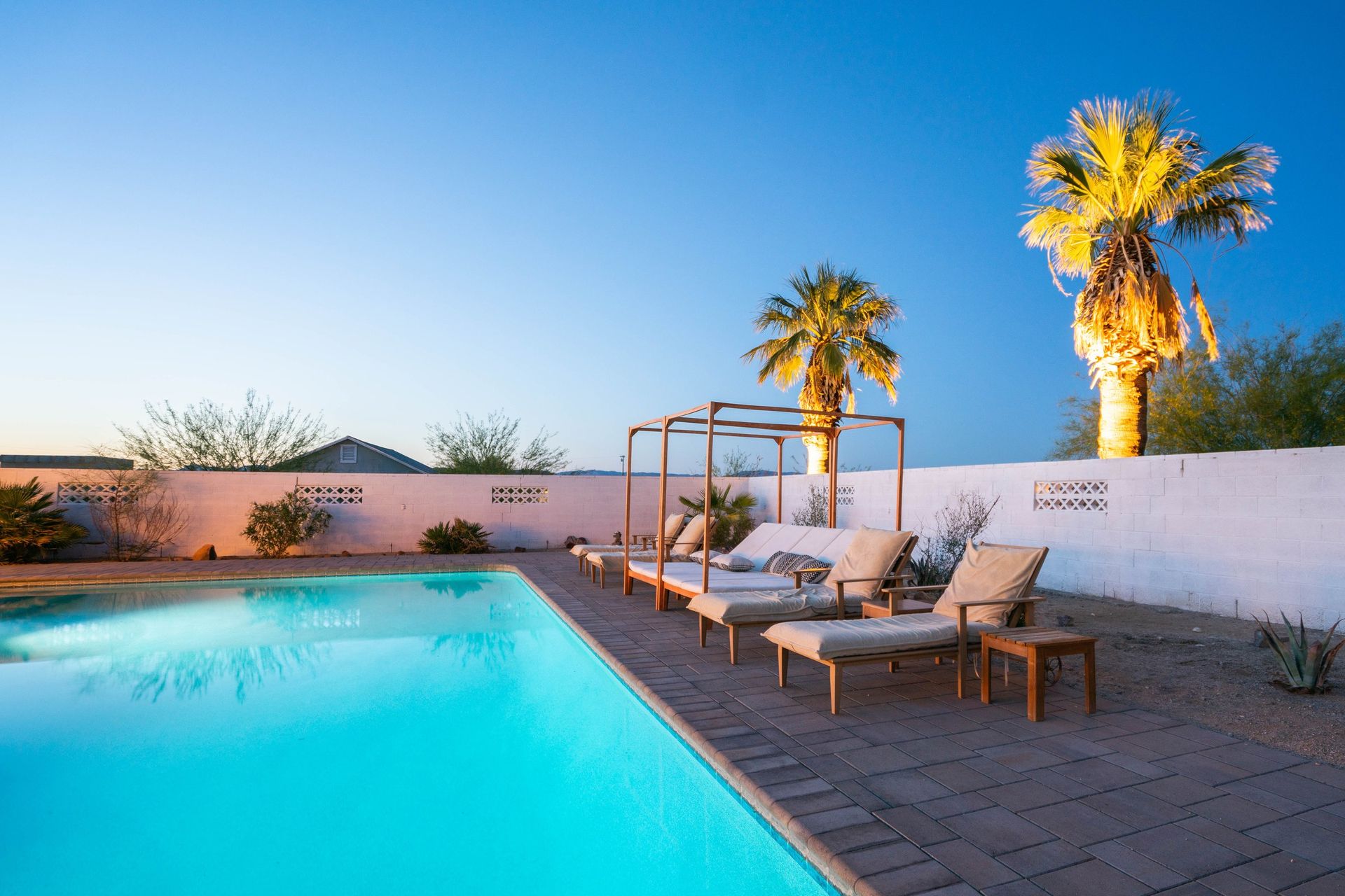 Wonder Valley Ranch saltwater pool flanked by palms, Twentynine Palms